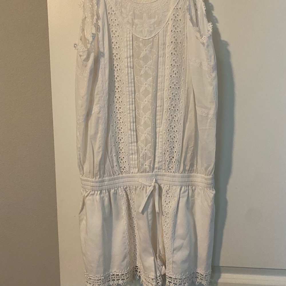 White romper. Never warn, but a few years old